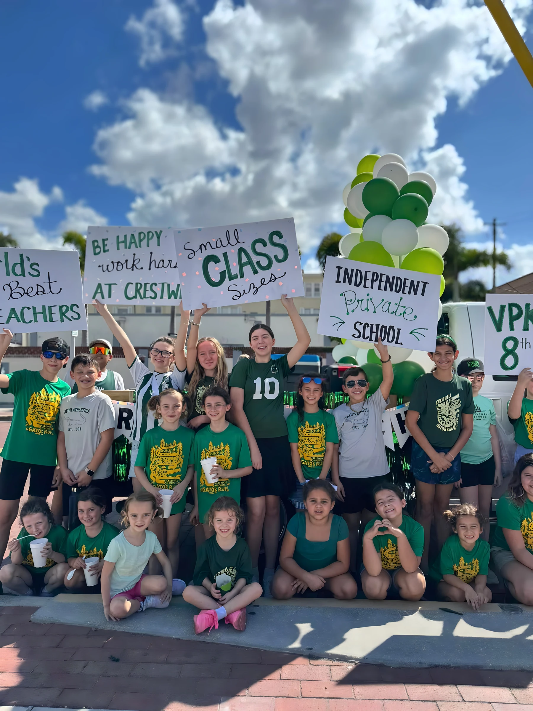 Students holding school spirit signs