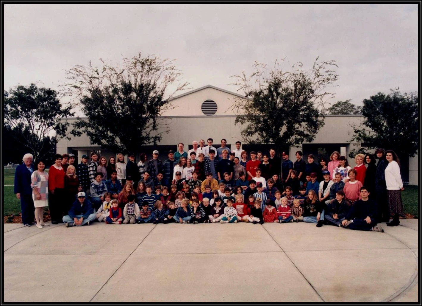 The school community gathered in front of the Citrus Oaks campus in 1999